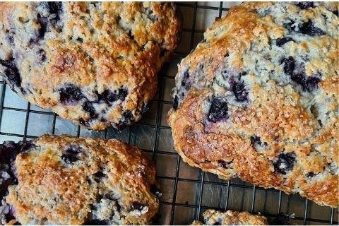 Blueberry scones on a cooling rack.