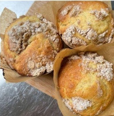 Streusel-topped muffins in paper liners.